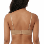 Woman wearing a beige lingerie set on a white background