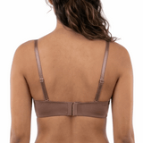 Model wearing a mocha bra on a white background