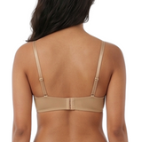 Woman wearing a beige lingerie set on a white background