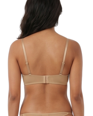 Woman wearing a beige lingerie set on a white background