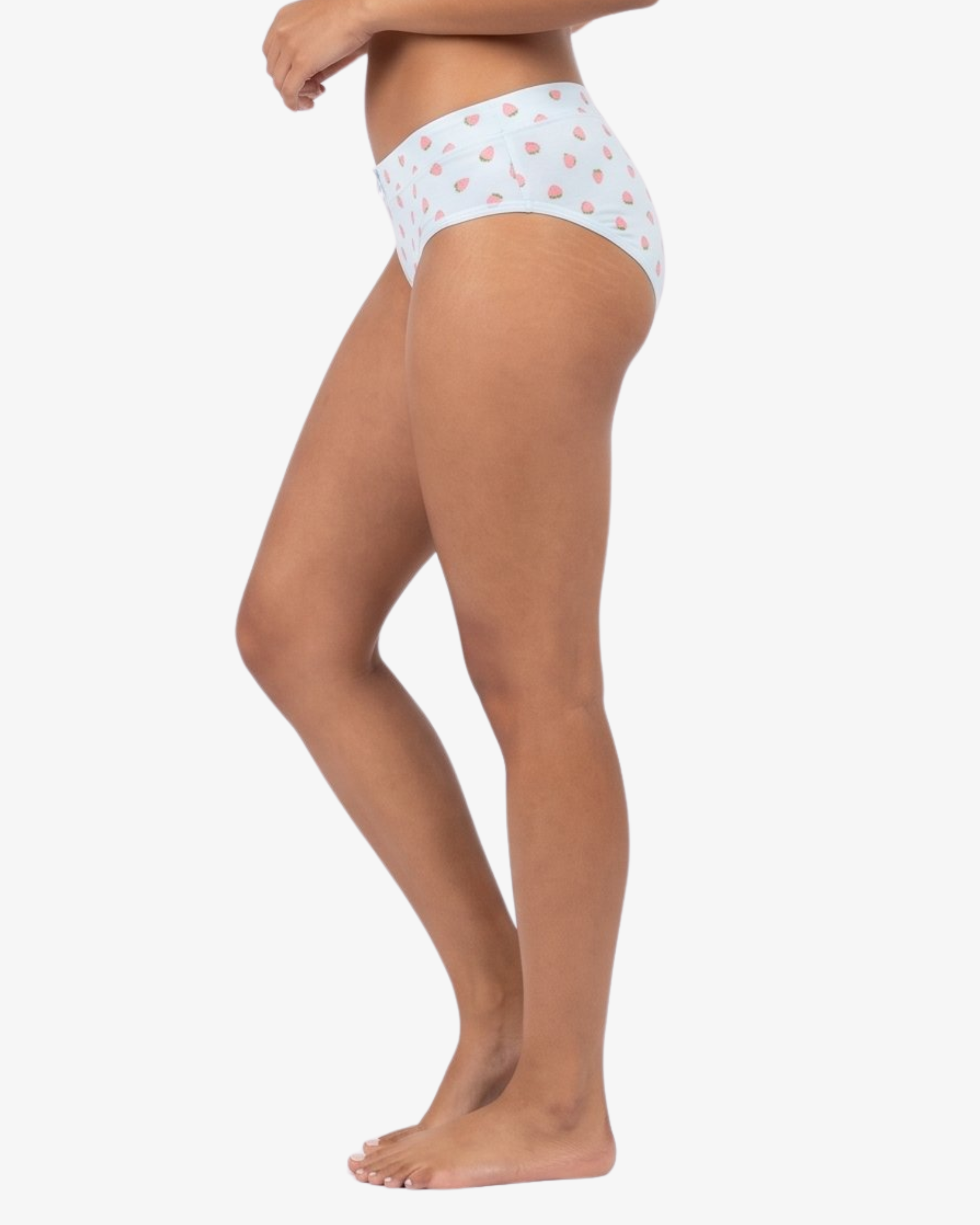 Side view of a model wearing blue high-waisted briefs with a small pink strawberry pattern, shown against a plain light gray background.