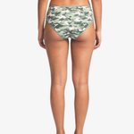 Rear view of a model wearing camouflage hipster bottoms against a light gray studio background.