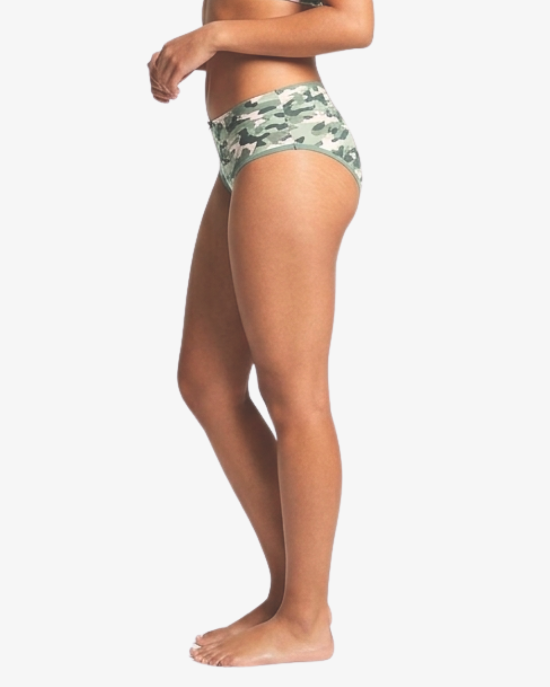 Side view of a model wearing camouflage hipster bottoms against a plain light gray background.