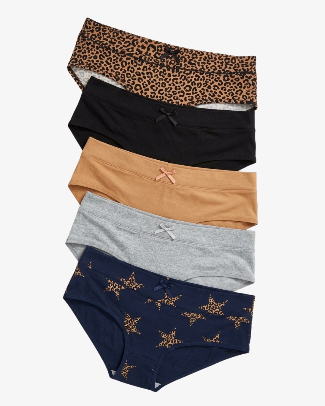 Five pairs of women's underwear stacked vertically on a light gray background. The styles include a leopard print, solid black, solid tan, solid heather gray, and navy blue with small gold star prints.