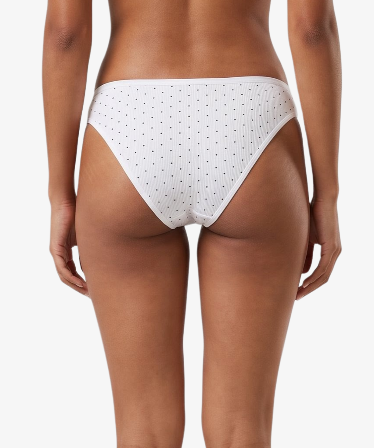 White bikini bottom with small black polka dots, shown on a model against a light gray background.