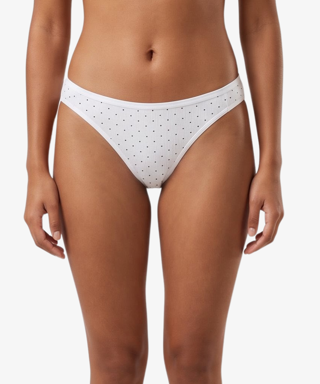 White bikini bottom with small black polka dots, shown on a model against a light gray background.