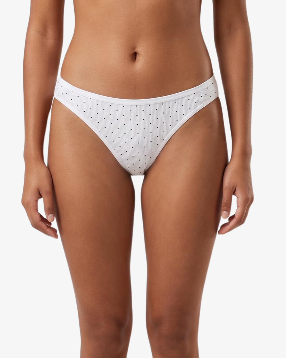 White bikini bottom with small black polka dots, shown on a model against a light gray background.