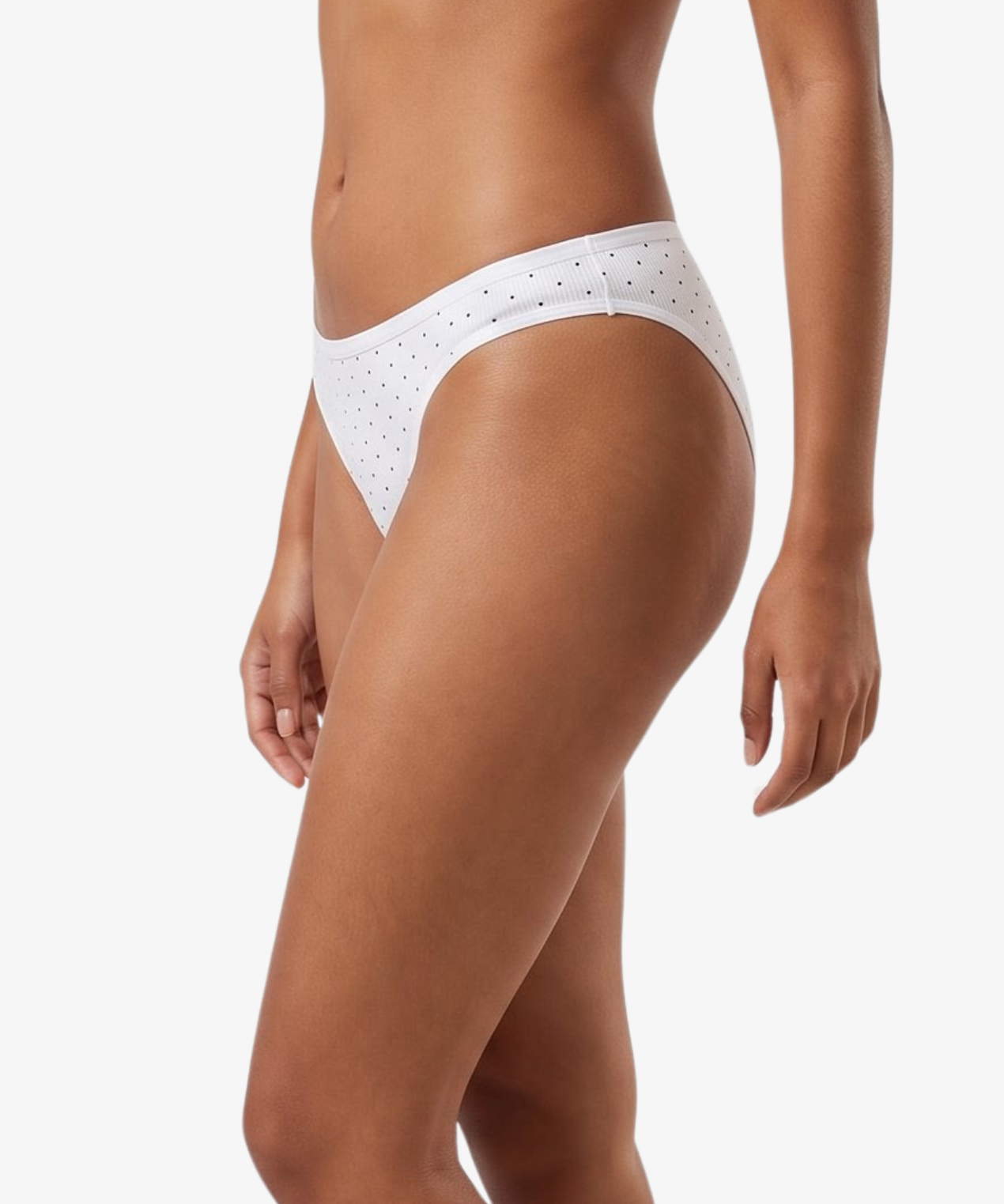 White bikini bottom with small black polka dots, shown on a model against a light gray background.