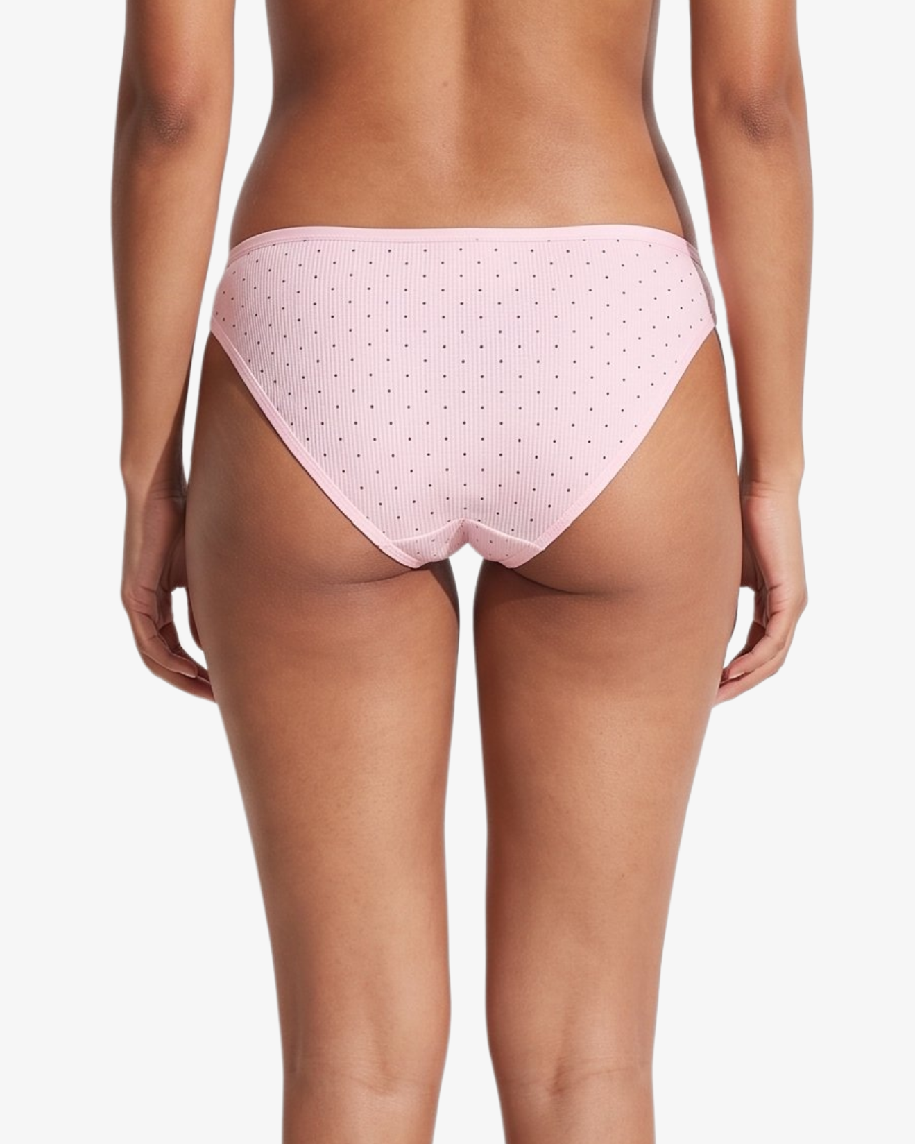 Pink bikini bottom with small brown polka dots, shown on a model against a light gray background.