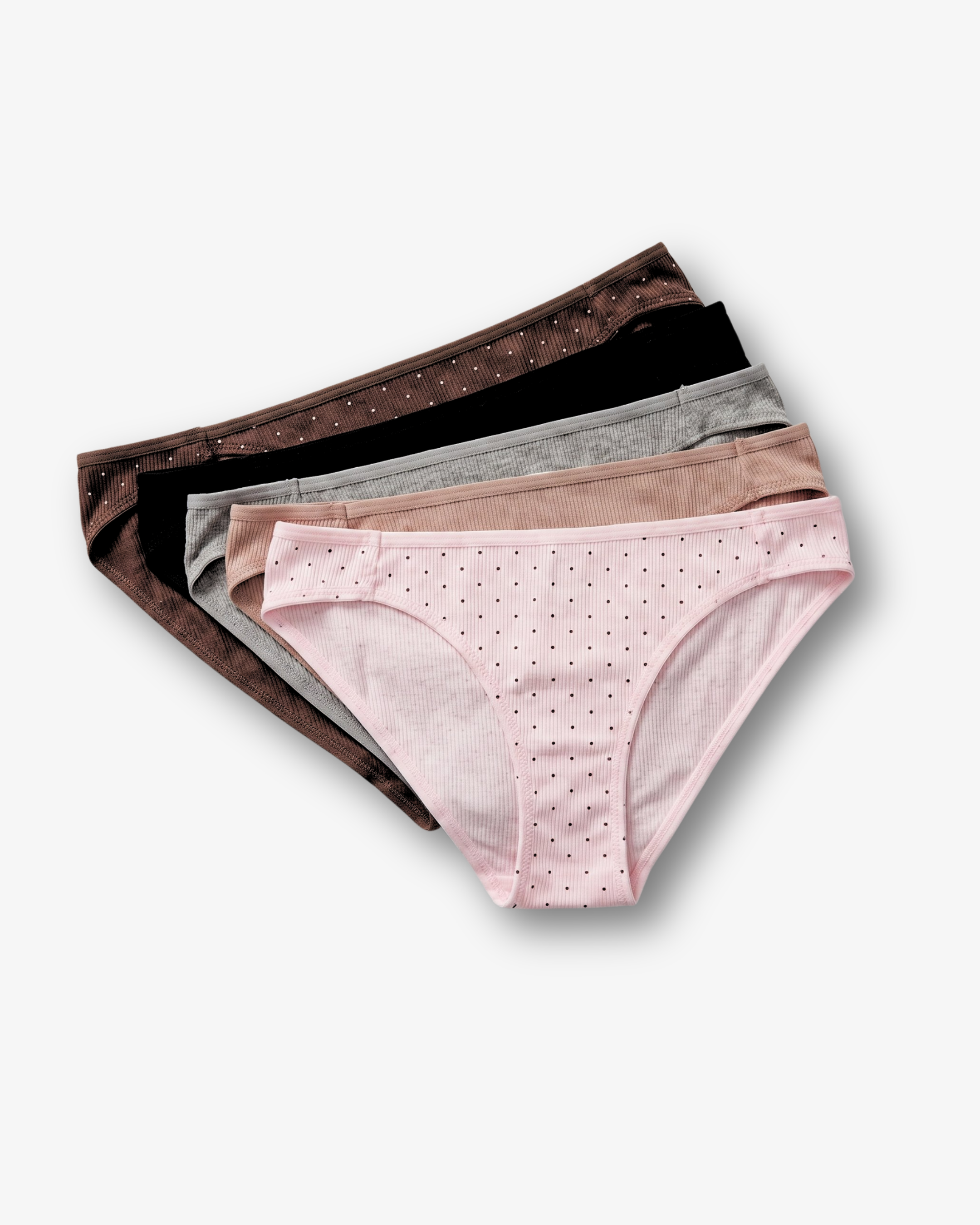 A stack of five women's bikini bottoms in different colors, each with small polka dots, arranged diagonally on a light gray background.