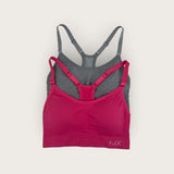 Pink and gray bra set on a light beige background