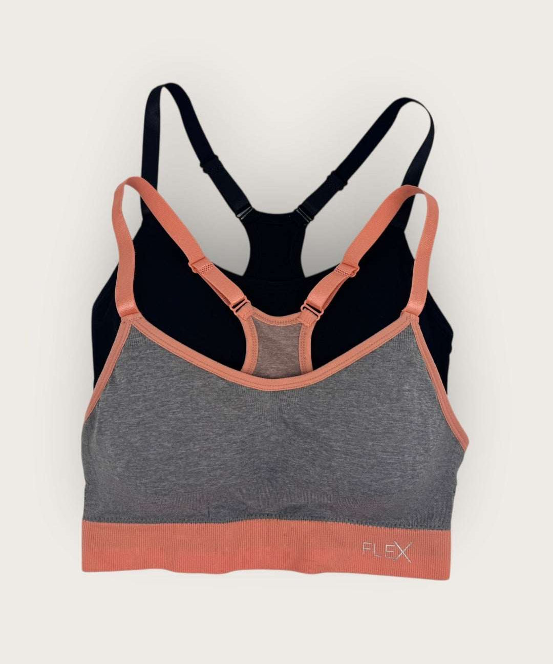 Multicolored sports bra with 'Flex' branding on a light gray background