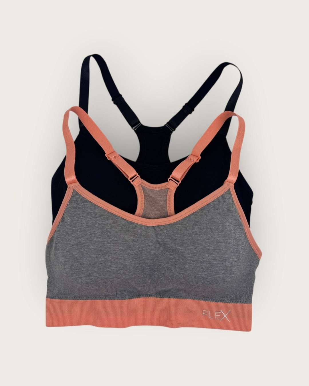 Multicolored sports bra with 'Flex' branding on a light gray background