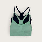 Green and black sports bra on a white background