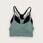 Green and black sports bra on a white background