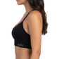 Woman wearing a black sports bra with 'FLEX' branding on a white background