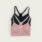 Pink and black bra on a light gray background