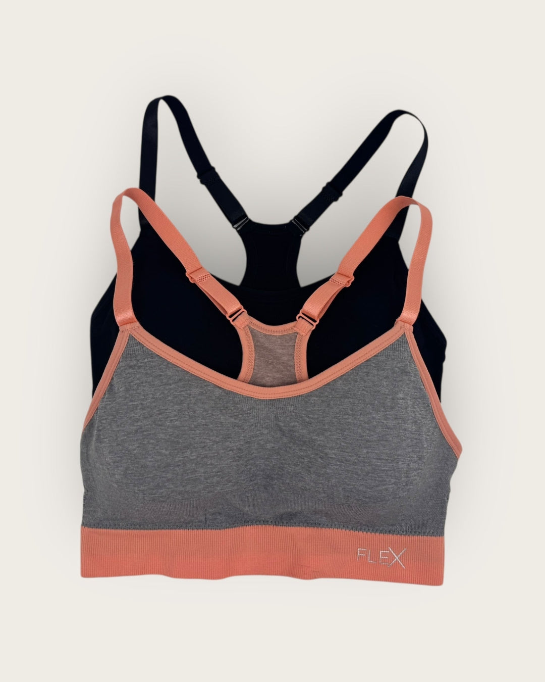 Multicolored sports bra with 'Flex' branding on a light gray background