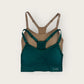 Green and brown sports bra with 'FLEX' branding on a beige background