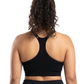 Woman in a black sports bra against a white background.