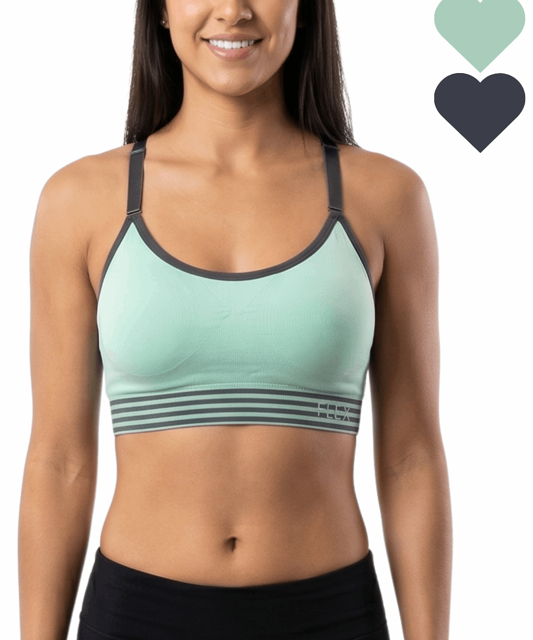 Woman wearing a green sports bra with black accents on a white background