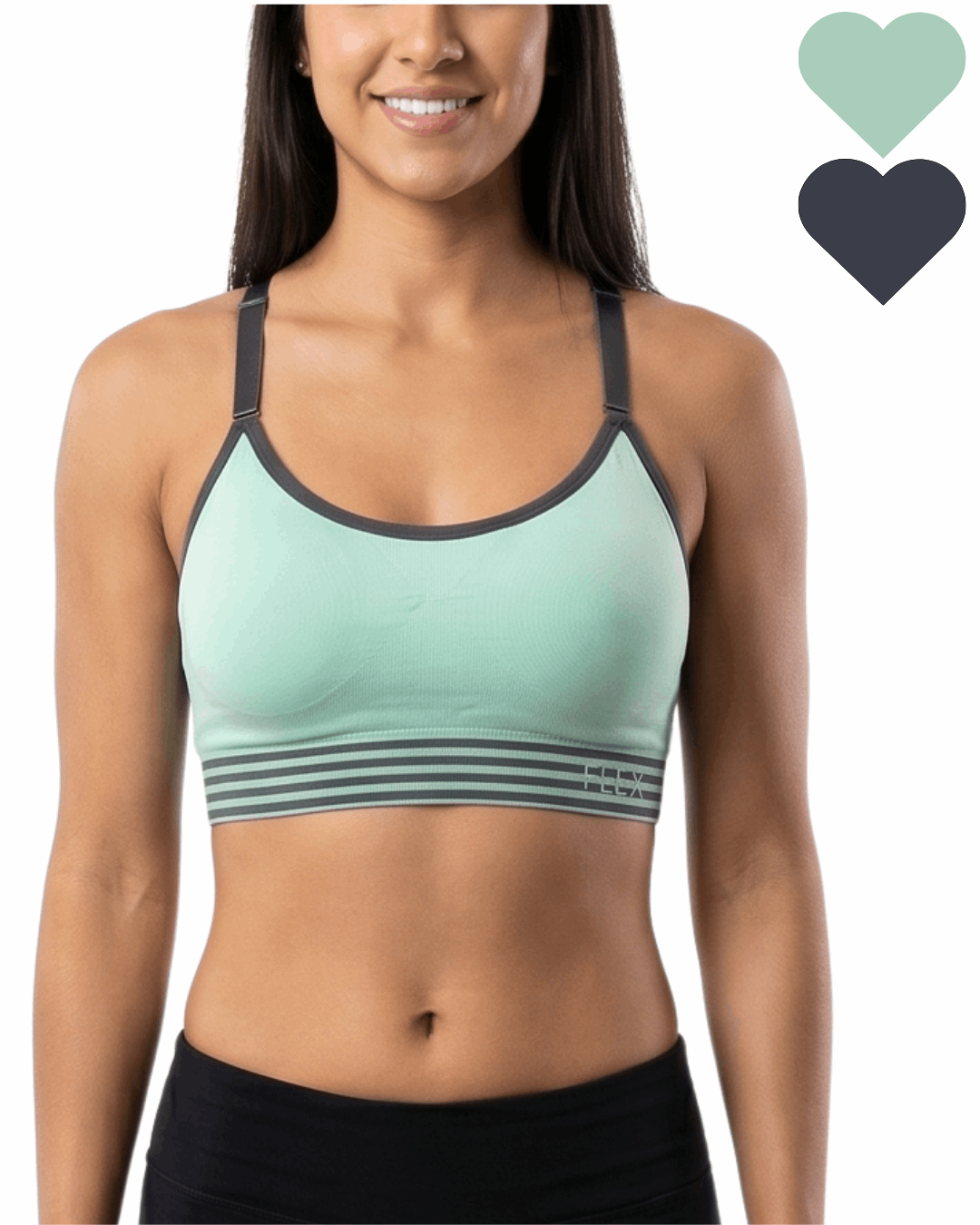 Woman wearing a green sports bra with black accents on a white background