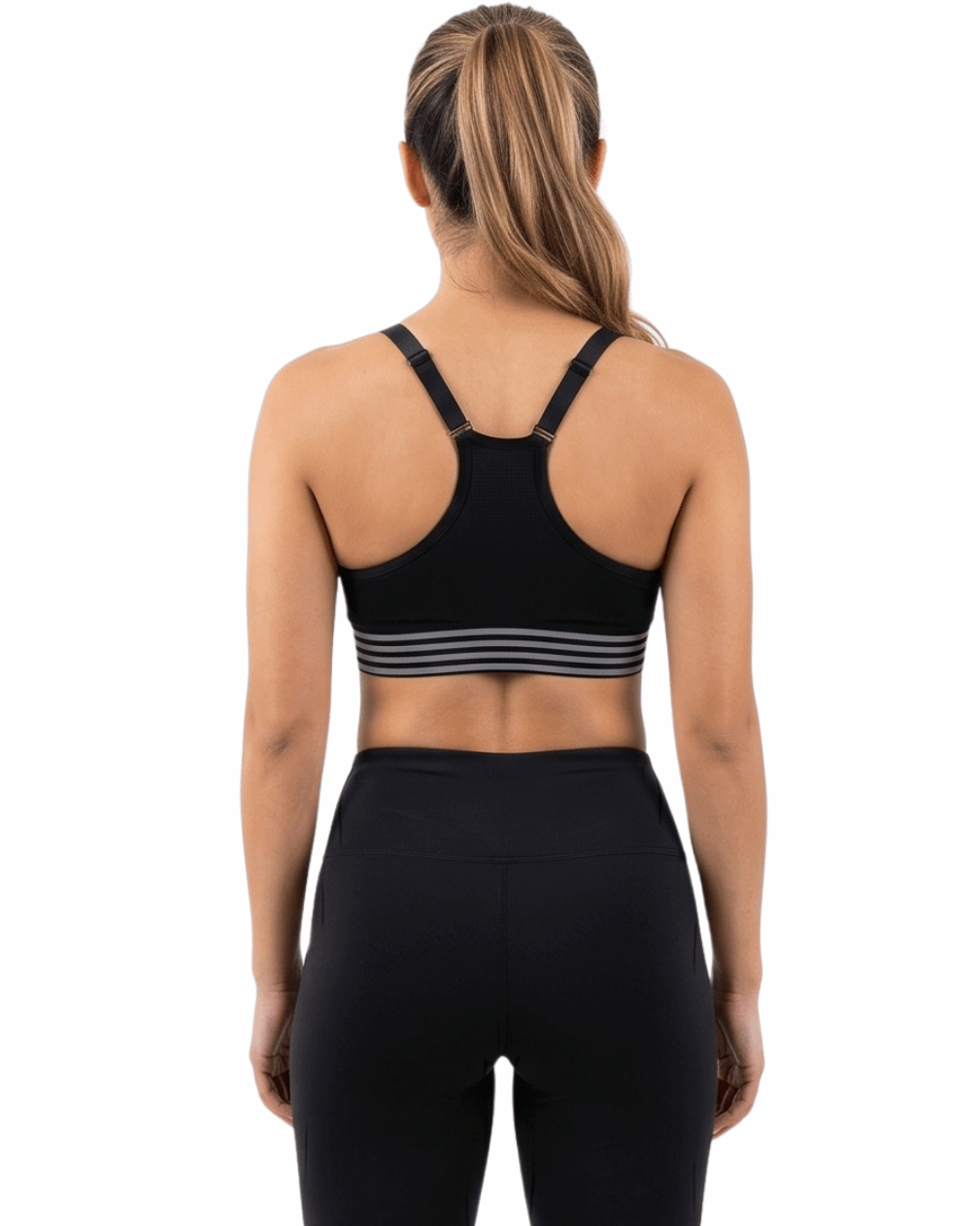 Person wearing a black sports bra and leggings on a white background
