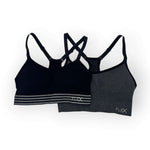 Two black sports bras with 'FLEX' branding on a white background