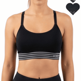 Black sports bra with striped design worn by a person on a white background