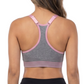 Woman wearing a sports bra and black leggings on a white background