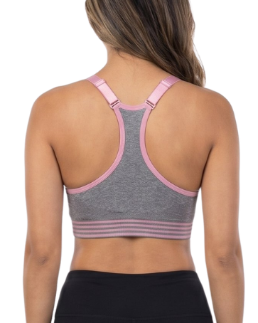 Woman wearing a sports bra and black leggings on a white background