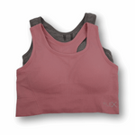 Pink and gray sports bra on a white background