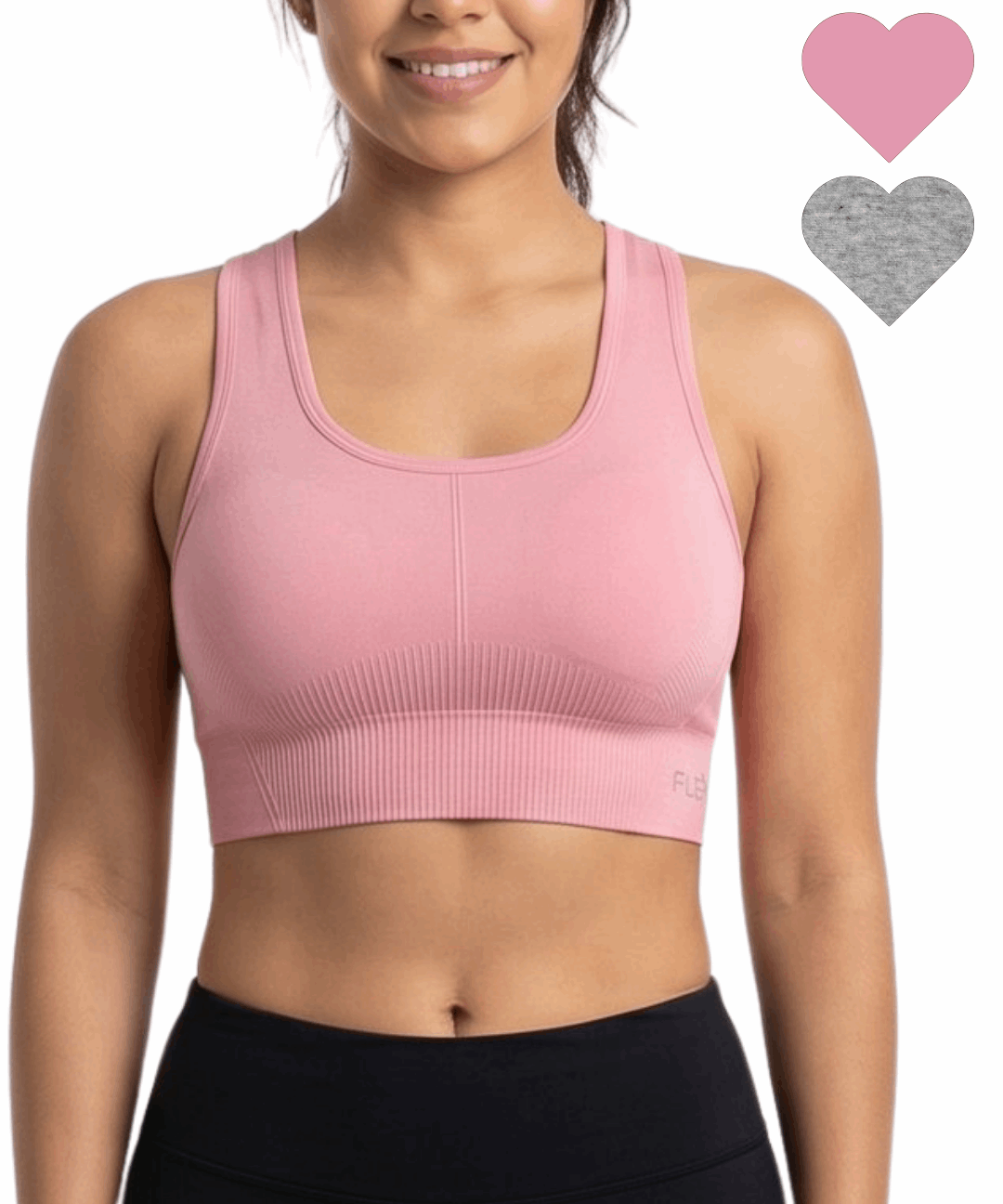 Woman wearing a pink sports bra with heart icons on a white background