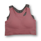 Pink and gray sports bra on a white background