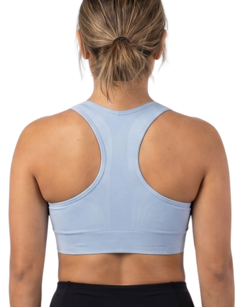Person wearing a light blue sports bra and black leggings on a white background
