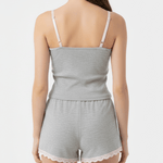 Light gray romper with lace trim on a plain background