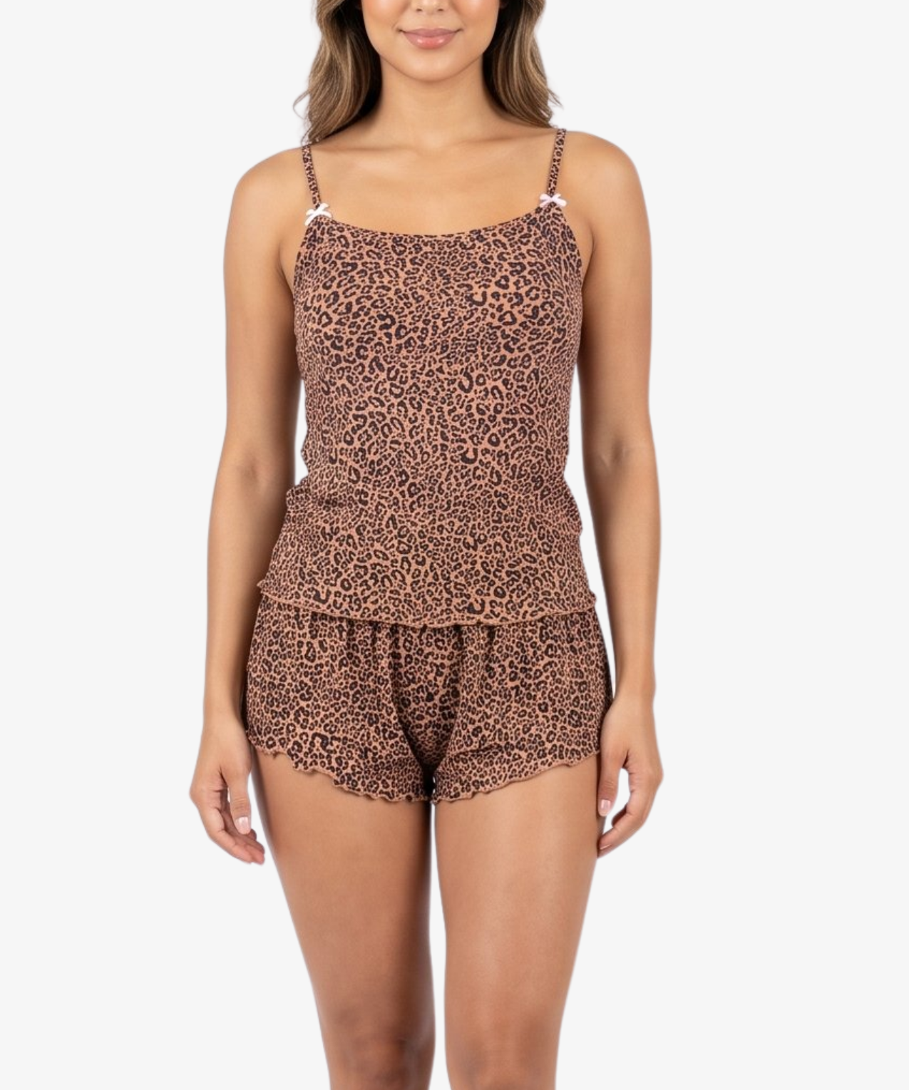 A woman modeling a matching two-piece swimsuit with a brown and black leopard print pattern, featuring a spaghetti-strap tankini top and matching shorts, set against a plain white background.