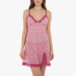 Pink nightgown with heart pattern worn by a model on a white background