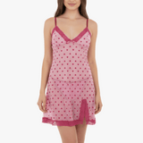 Pink nightgown with heart pattern worn by a model on a white background