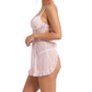 Woman wearing a light pink lace nightgown on a white background