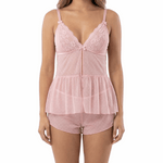 Woman wearing a pink lace nightgown on a white background