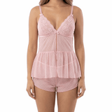 Woman wearing a pink lace nightgown on a white background