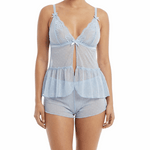 Woman wearing a light blue lace lingerie set on a white background