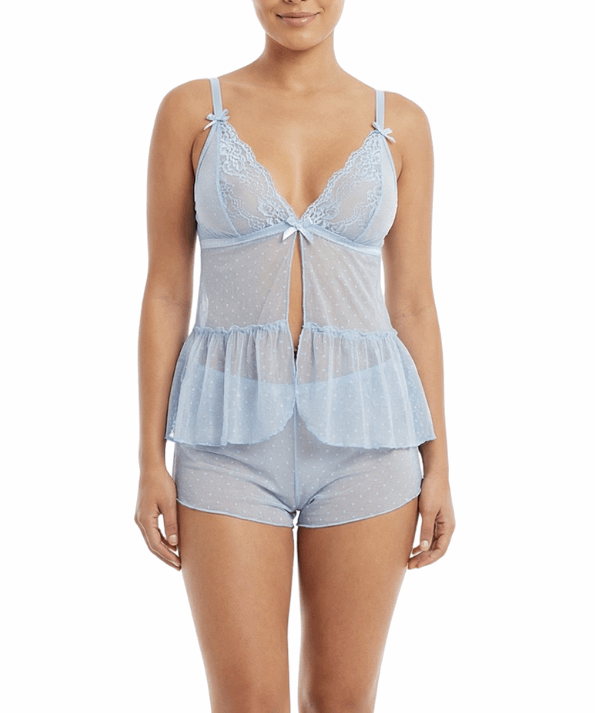 Woman wearing a light blue lace lingerie set on a white background