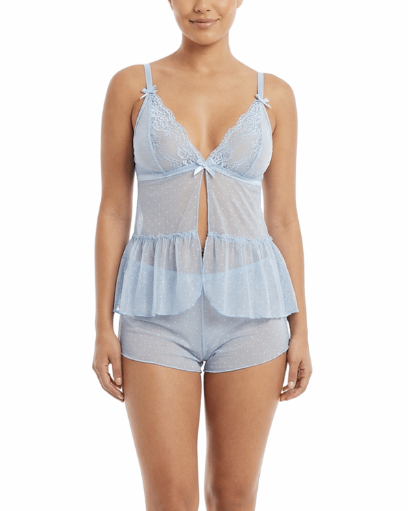 Woman wearing a light blue lace lingerie set on a white background