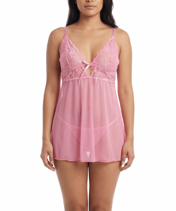 Woman wearing a pink lace babydoll lingerie on a white background