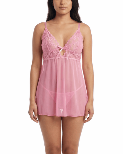 Woman wearing a pink lace babydoll lingerie on a white background