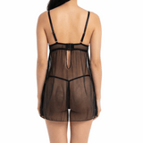 Woman wearing a sheer black nightgown on a white background