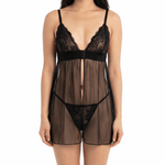 Woman wearing a black lace lingerie set on a white background