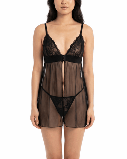 Woman wearing a black lace lingerie set on a white background